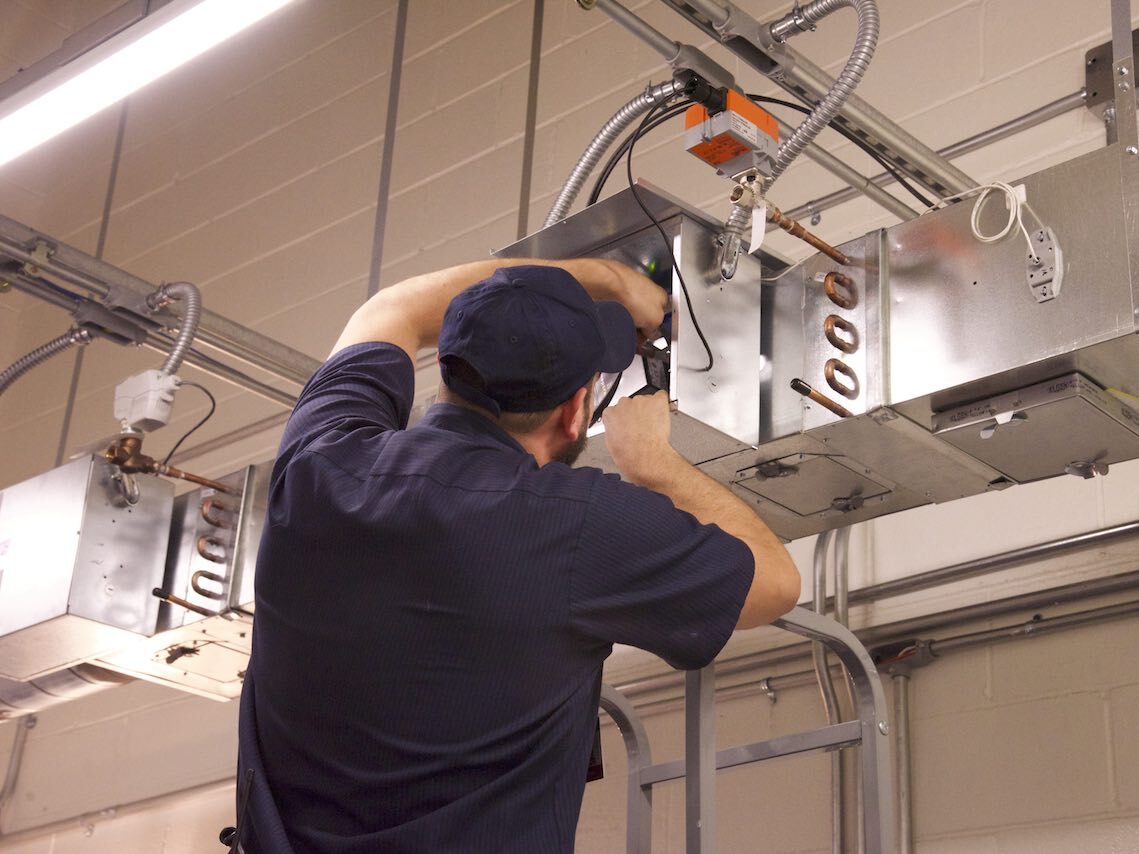 Man repairing HVACR systems