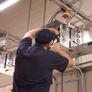 Man working on HVAC equipment